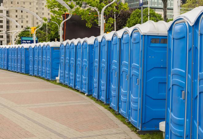 a line of portable restrooms at an outdoor wedding, catering to guests with style and comfort in Bannockburn, IL